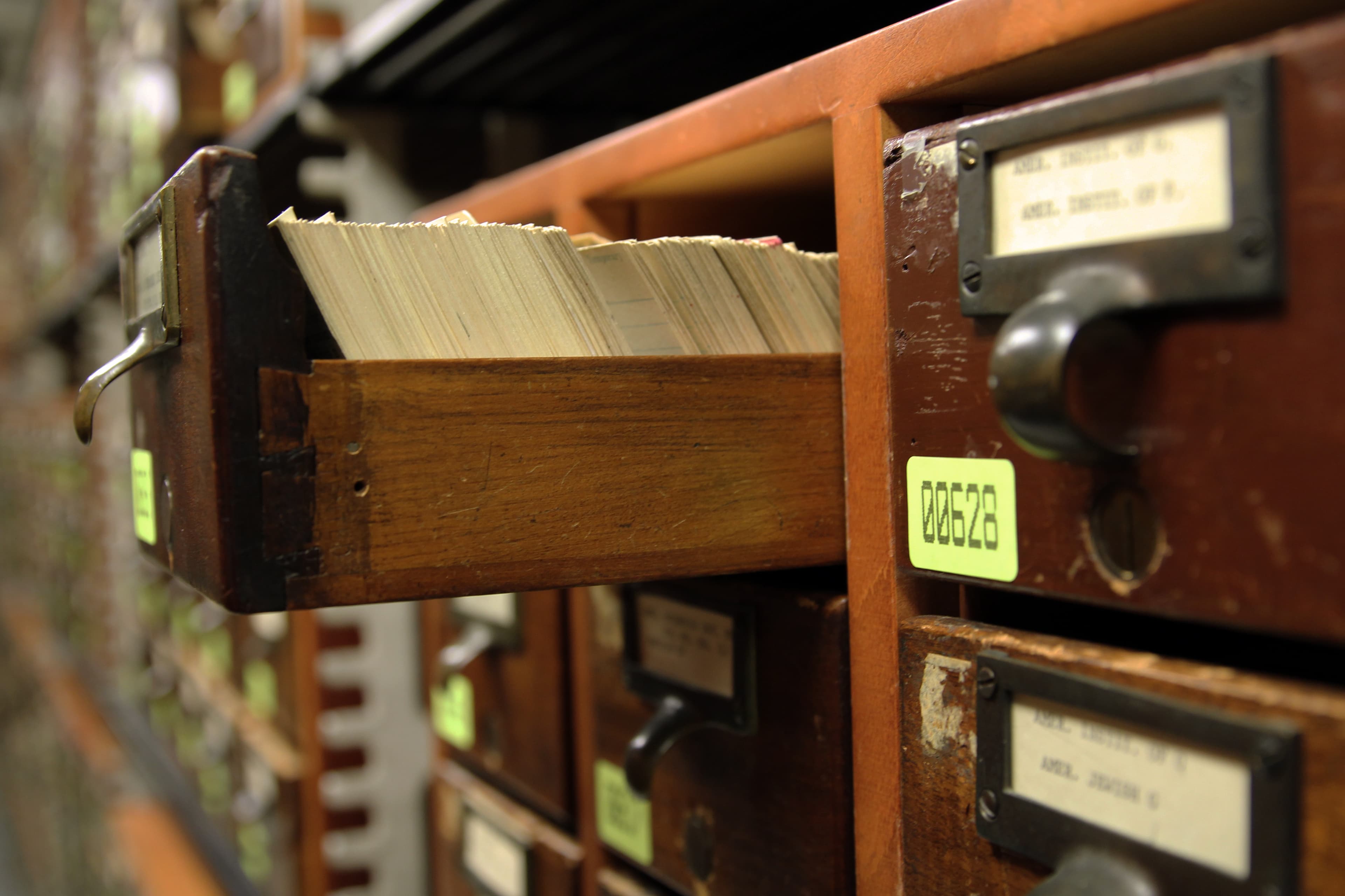 The card catalog room at the Library of Congress -- rows of wooden drawers where every claim could be traced back to a card, a shelf, a book